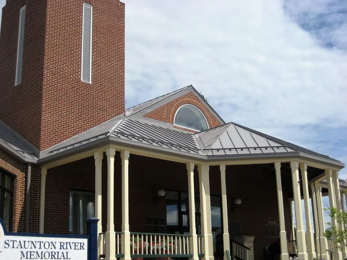 Skilled roofing craftsmen working on a residential roof in Lavaca